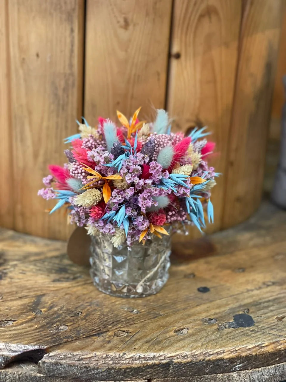 Colourful miniature dried-flower wedding table arrangement
