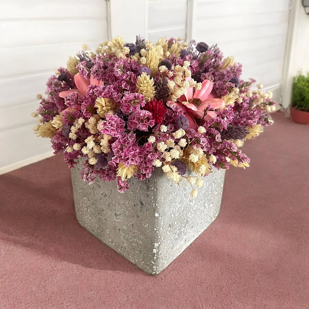 Purple and cream dried-flower wedding table arrangement